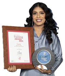 photo of Tanu Jayaswal holding her Queensland Training Awards 2024 finalist certificate and winning trophy.